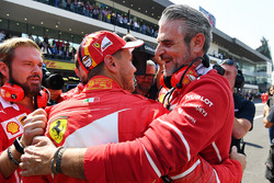 Pole sitter Sebastian Vettel, Ferrari celebrates in parc ferme with Maurizio Arrivabene, Ferrari Tea