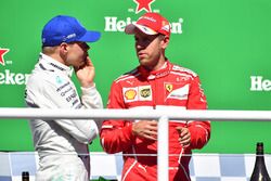 Podium: winnaar Sebastian Vettel, Ferrari, tweede Valtteri Bottas, Mercedes AMG F1