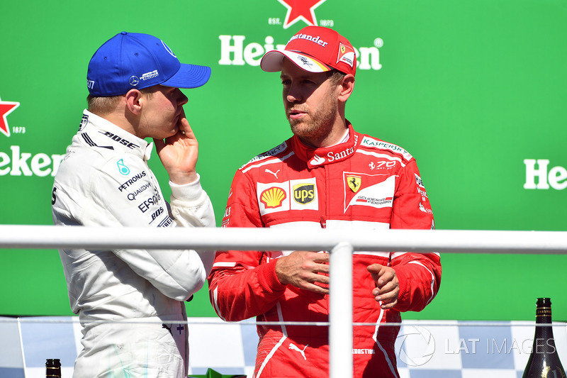 Podium: winner Sebastian Vettel, Ferrari, second place Valtteri Bottas, Mercedes AMG F1