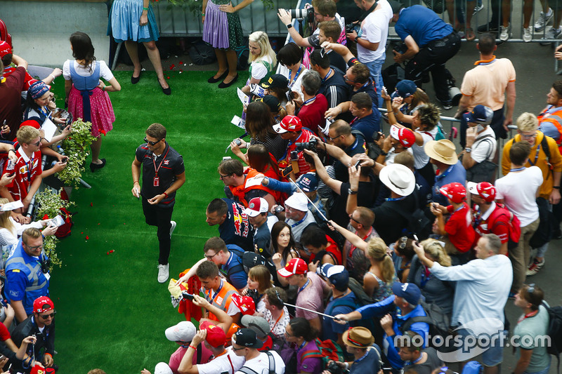 Romain Grosjean, Haas F1 Team, signs autographs for fans