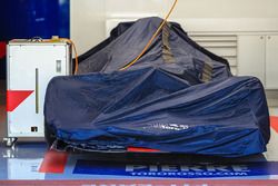 Scuderia Toro Rosso STR12 under covers in the garage