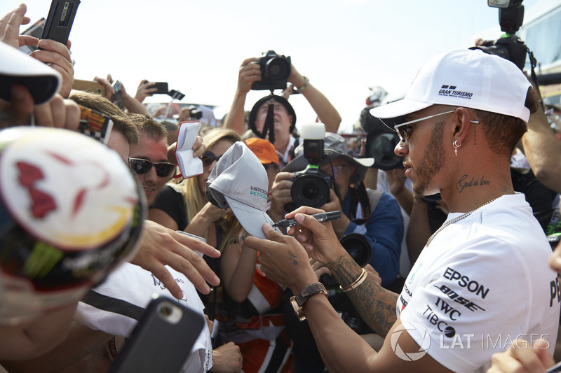 Lewis Hamilton, Mercedes AMG F1, signs autographs for fans