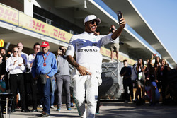 Lewis Hamilton, Mercedes AMG F1, takes a selfie as he celebrates winning the Constructors' Champions