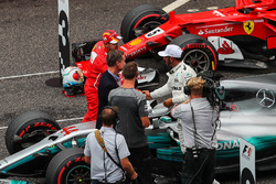 Sebastian Vettel, Ferrari and Lewis Hamilton, Mercedes AMG F1 celebrate in parc ferme alongside David Coulthard, Channel Four TV Commentator and Jenson Button (GBR)