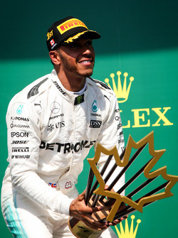 Race winner Lewis Hamilton, Mercedes AMG F1 celebrates on the podium, the trophy