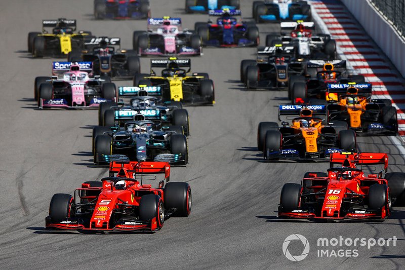 Sebastian Vettel, Ferrari SF90, leads Charles Leclerc, Ferrari SF90 at the start of the race