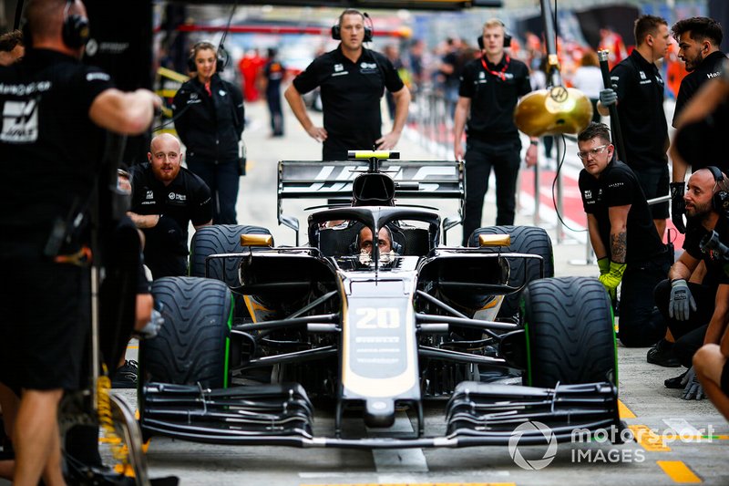 The Haas team practice a pit stop