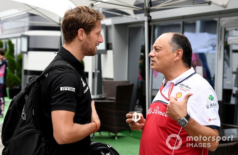 Romain Grosjean, Haas F1 Team speaks with Frederic Vasseur, Team Principal, Alfa Romeo Racing