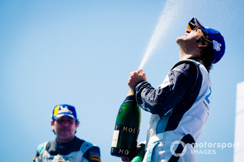 Race winner Sérgio Jimenez, Jaguar Brazil Racing celebrates with the champagne on the podium