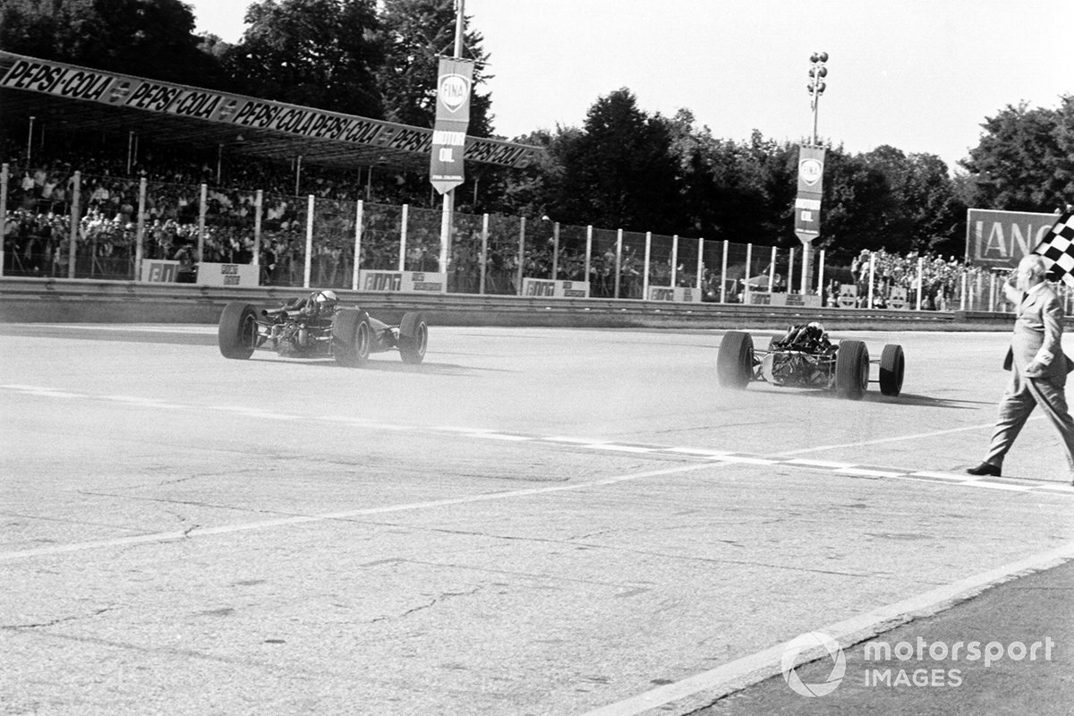 John Surtees, Honda RA300, 1st position, leads Jack Brabham, Brabham BT24-Repco at the finish line