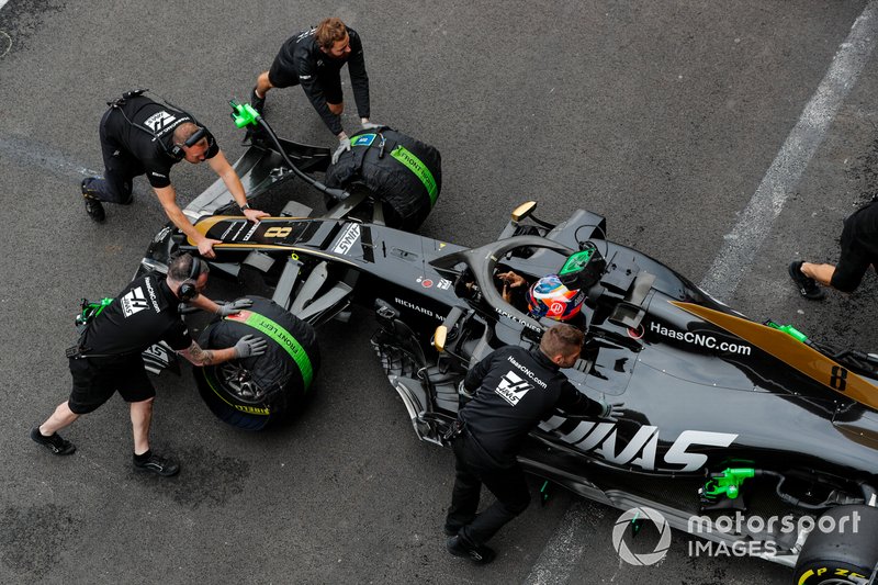 Romain Grosjean, Haas F1 Team VF-19, is returned to the garage