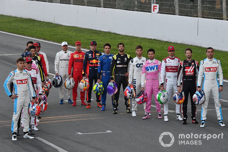 The drivers line up on the track