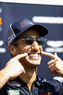 Daniel Ricciardo, Red Bull Racing, points to his moustache