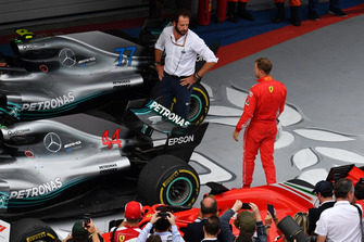 Matteo Bonciani, FIA Media Delegate and Sebastian Vettel, Ferrari in parc ferme with Mercedes-AMG F1 W09