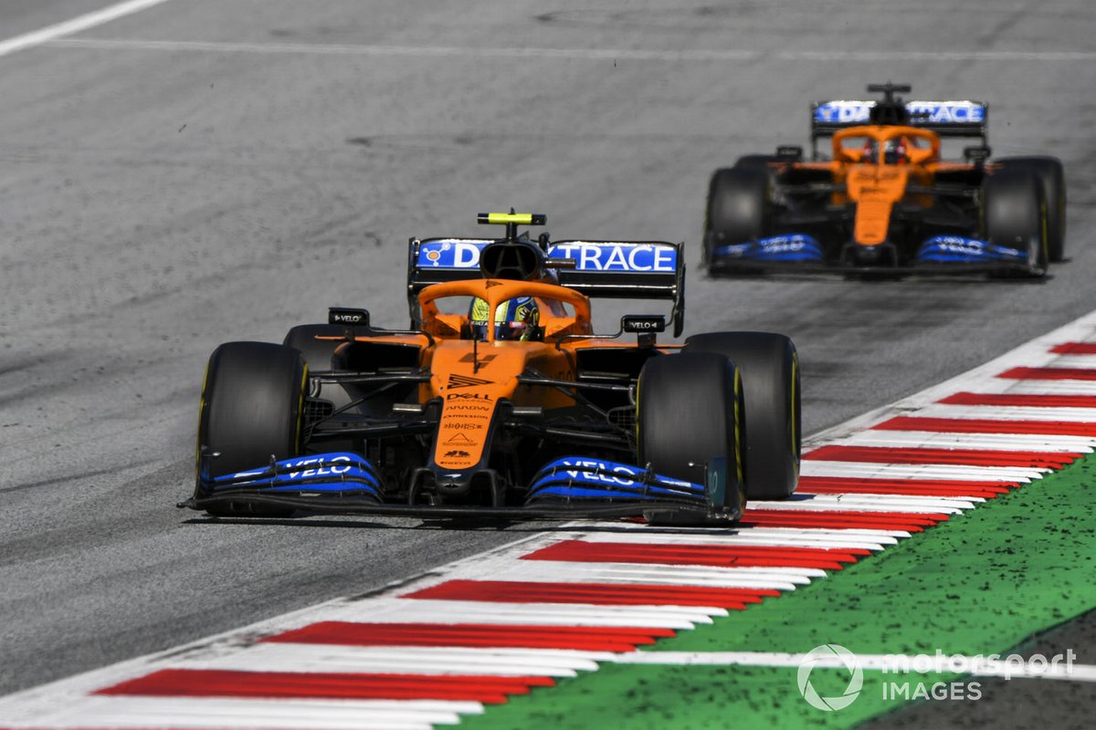 Lando Norris, McLaren MCL35, leads Carlos Sainz Jr., McLaren MCL35