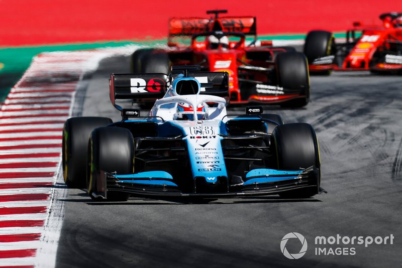 George Russell, Williams Racing FW42, leads Sebastian Vettel, Ferrari SF90, and Charles Leclerc, Ferrari SF90