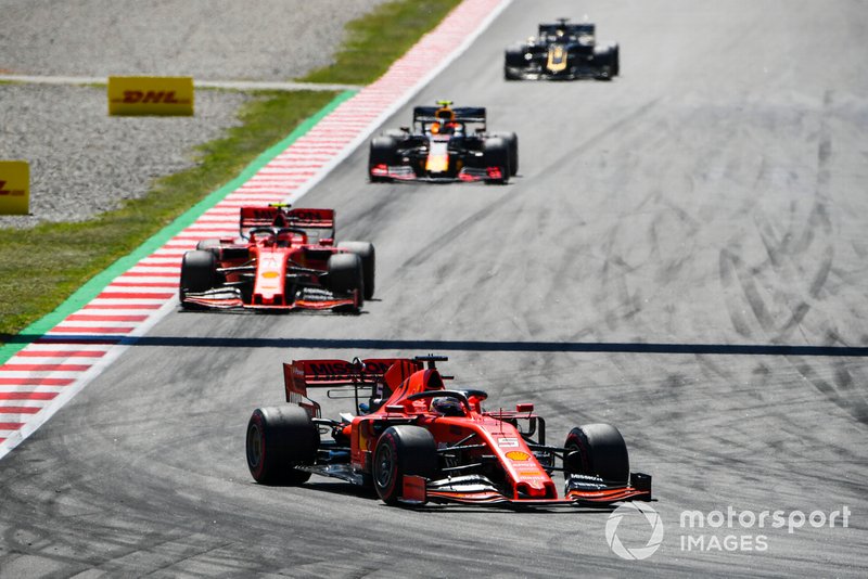 Sebastian Vettel, Ferrari SF90, leads Charles Leclerc, Ferrari SF90, and Pierre Gasly, Red Bull Racing RB15