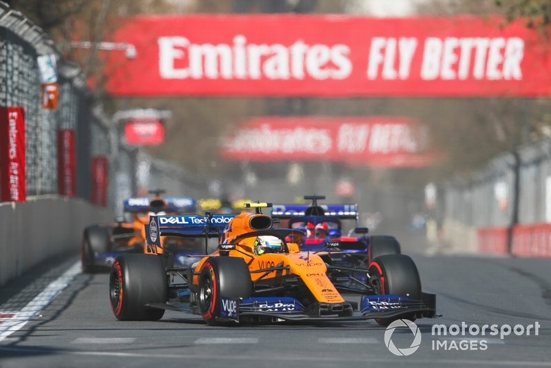 Lando Norris, McLaren MCL34, leads Daniil Kvyat, Toro Rosso STR14