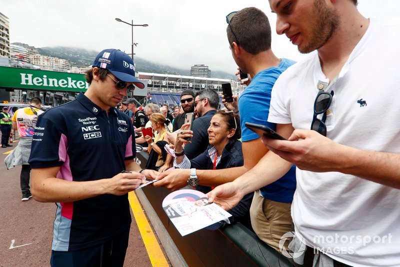 Lance Stroll, Racing Point signs a autograph for a fan