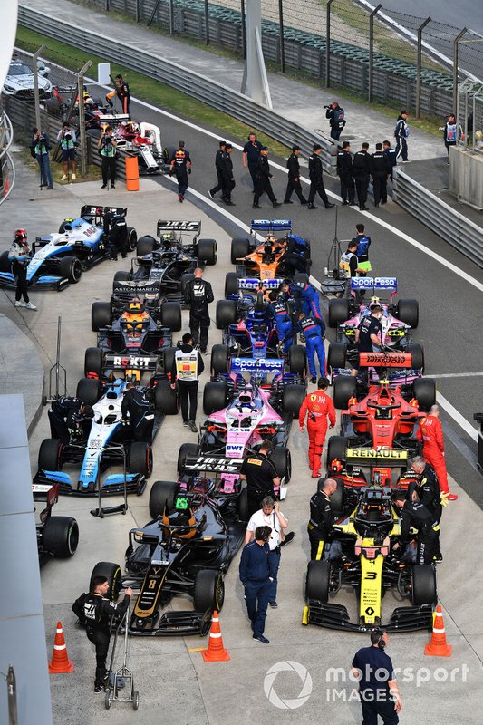 The cars and mechanics in Parc Ferme after the race