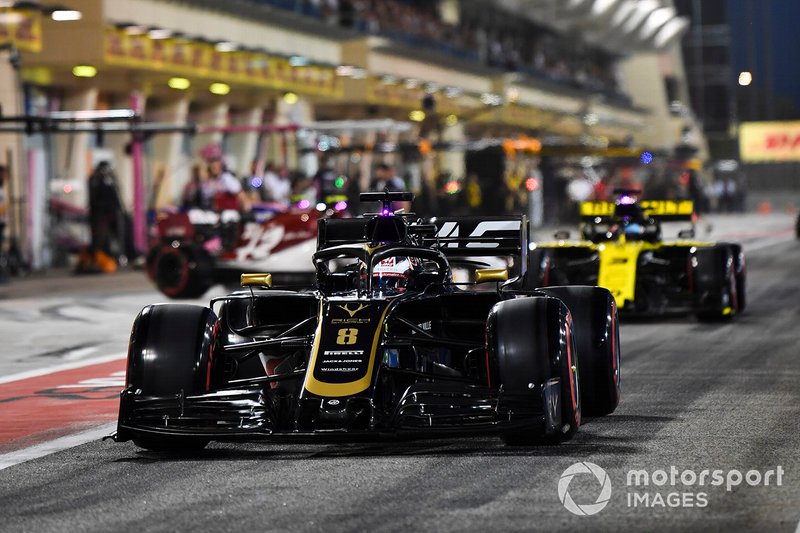 Romain Grosjean, Haas F1 Team VF-19, Daniel Ricciardo, Renault R.S.19, in the pit lane