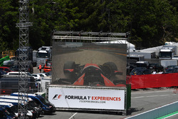 Giant screen and race retiree Stoffel Vandoorne, McLaren MCL32