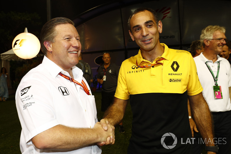 Zak Brown, Executive Director, McLaren Technology Group, Cyril Abiteboul, Managing Director, Renault Sport F1 Team, shake hands in the paddock