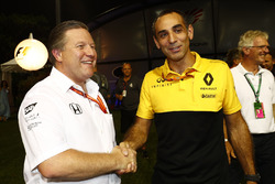 Zak Brown, Executive Director, McLaren Technology Group, Cyril Abiteboul, Managing Director, Renault Sport F1 Team, shake hands in the paddock