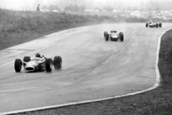 Graham Hill, Lotus 49-Ford, leads Jack Brabham, Brabham BT24-Repco, and Jackie Stewart, BRM P83