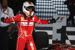 Sebastian Vettel, Ferrari, celebrates after winning the race