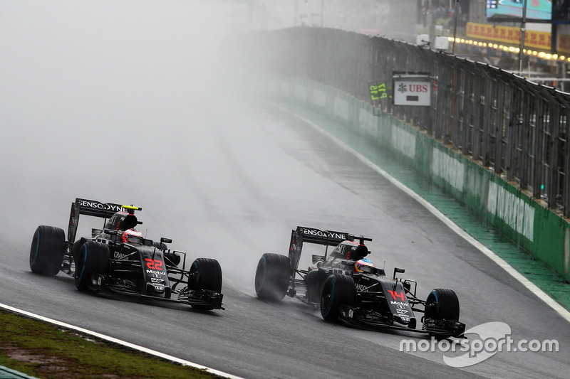 (L to R): Jenson Button, McLaren MP4-31 and team mate Fernando Alonso, McLaren MP4-31 battle for position