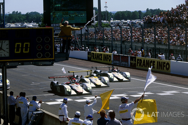 Emanuele Pirro leads the three Audi R8s to the checkered flag