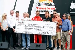 Sébastien Bourdais, Dale Coyne Racing Honda and Patrick Long present a check to Johns Hopkins All Children's Hospital