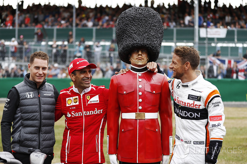 Stoffel Vandoorne, McLaren, MarcGene of Ferrari and Jenson Button, McLaren, with a dummy Scots Guard