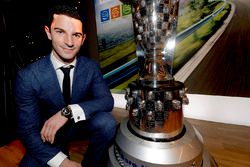 2016 Indy 500 winner Alexander Rossi looks at his face on the Borg-Warner trophy