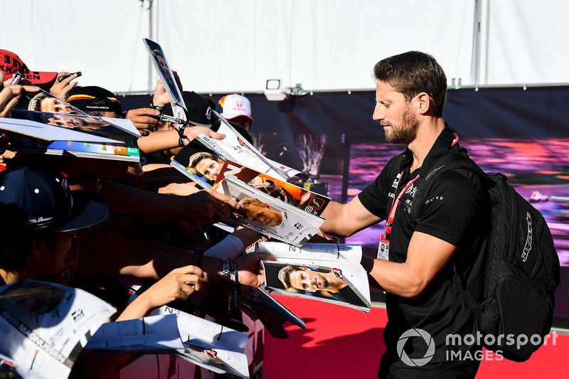Romain Grosjean, Haas F1 signs an autograph for a fan