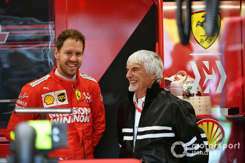 Bernie Ecclestone, Chairman Emiritus of Formula 1, in the Ferrari garage with Sebastian Vettel, Ferrari