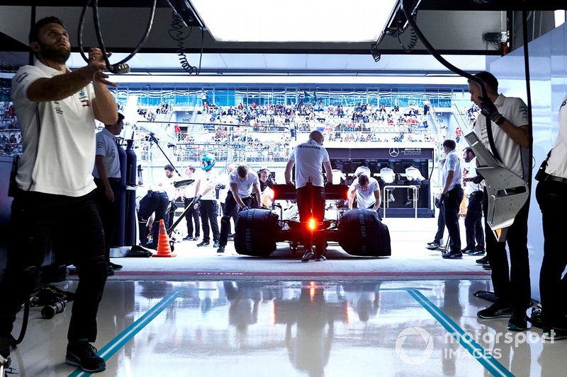 Lewis Hamilton, Mercedes AMG F1 W10, is returned to the garage