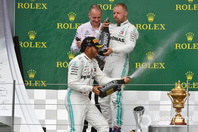 Lewis Hamilton, Mercedes AMG F1, 1st position, sprays Champagne from the podium