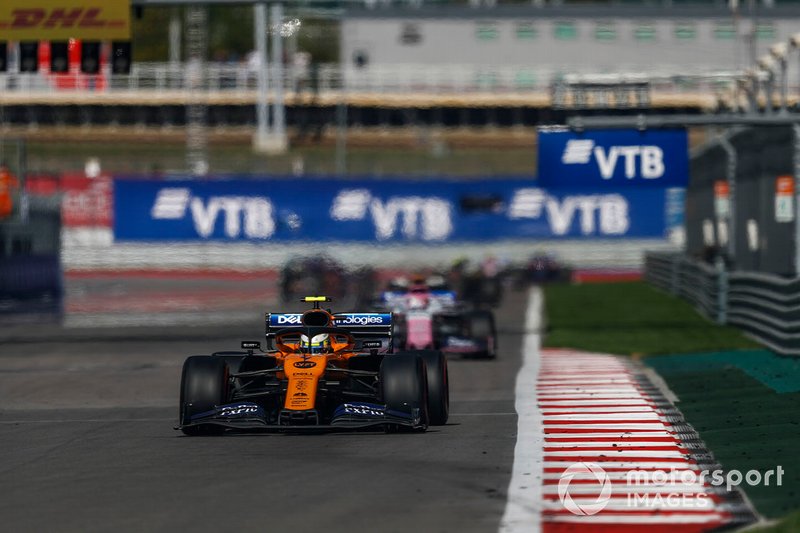 Lando Norris, McLaren MCL34, leads Sergio Perez, Racing Point RP19