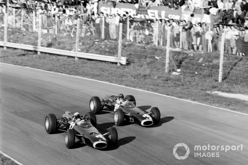 Jackie Stewart, BRM P261, 1st position, leads Graham Hill, BRM P261