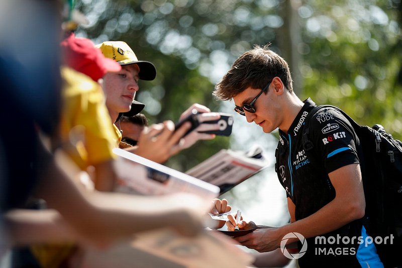 George Russell, Williams Racing signs autographs for fans