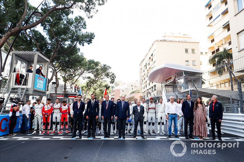 Drivers stand on the start line for the Monegasque national anthem