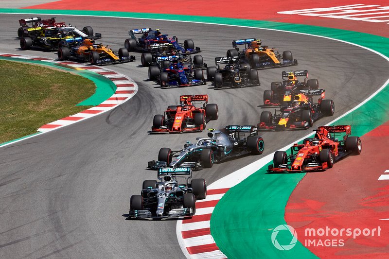 Lewis Hamilton, Mercedes AMG F1 W10, leads Valtteri Bottas, Mercedes AMG W10, Sebastian Vettel, Ferrari SF90,Max Verstappen, Red Bull Racing RB15, Charles Leclerc, Ferrari SF90, and the rest of the field in the first corner
