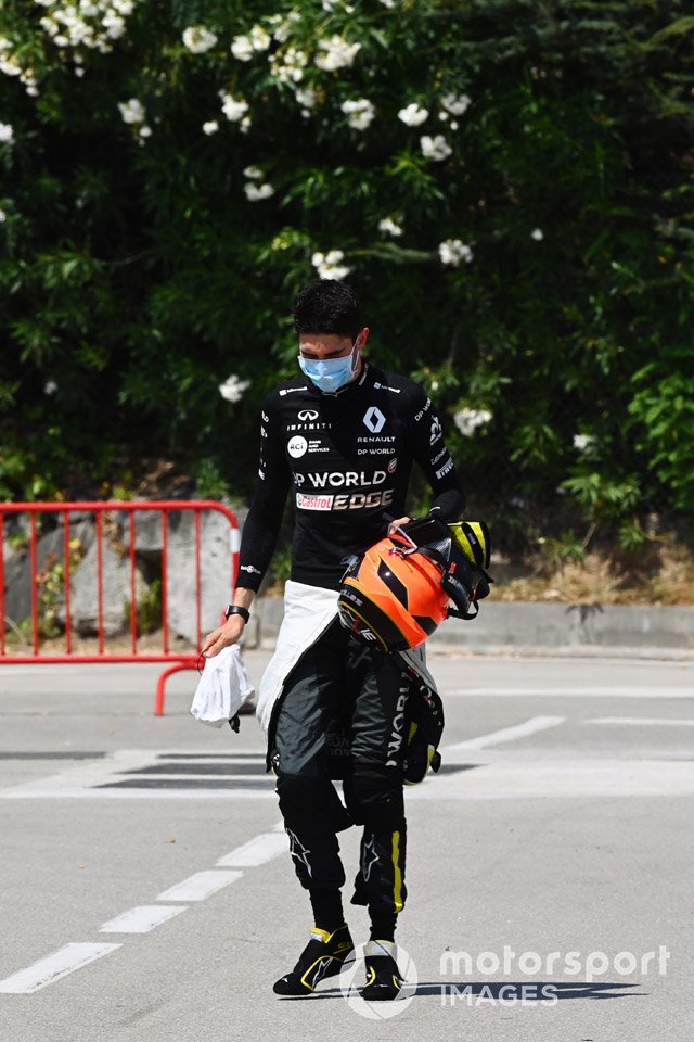 Esteban Ocon, Renault F1, walks back to his garage after a crash