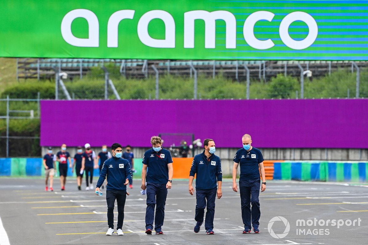 Sergio Sette Camara walks the track with team members