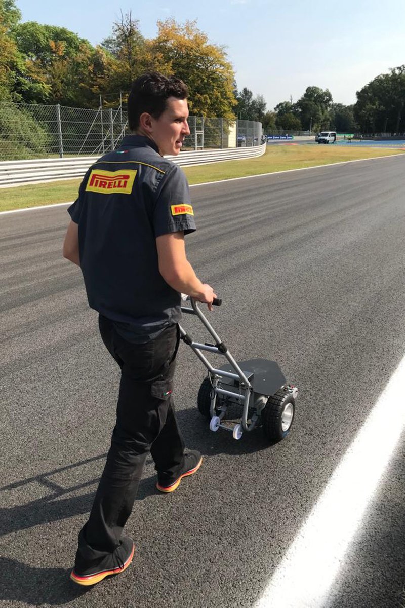 Pirelli engineer Martin Wahl operating the Pirelli Doggy, grip measurer