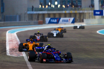 Pierre Gasly, Scuderia Toro Rosso STR13, leads Fernando Alonso, McLaren MCL33, and Kevin Magnussen, Haas F1 Team VF-18