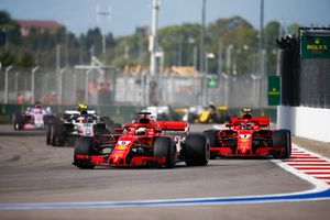 Sebastian Vettel, Ferrari SF71H, leads Kimi Raikkonen, Ferrari SF71H, and Kevin Magnussen, Haas F1 Team VF-18