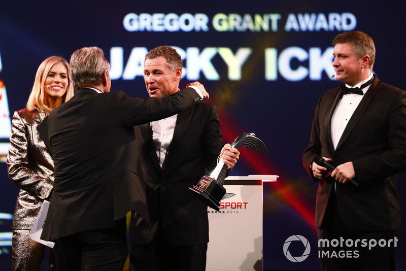 Tom Kristensen presents a Gregor Grant Award to Jacky Ickx